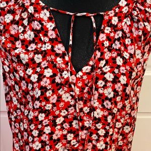Red orange floral blouse.